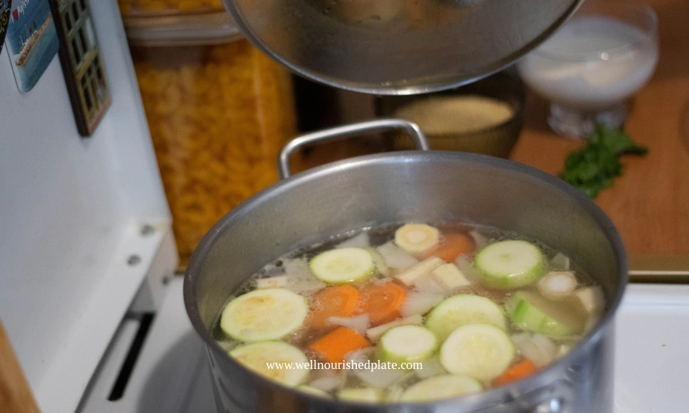 cooking vegetables for soup in a pot