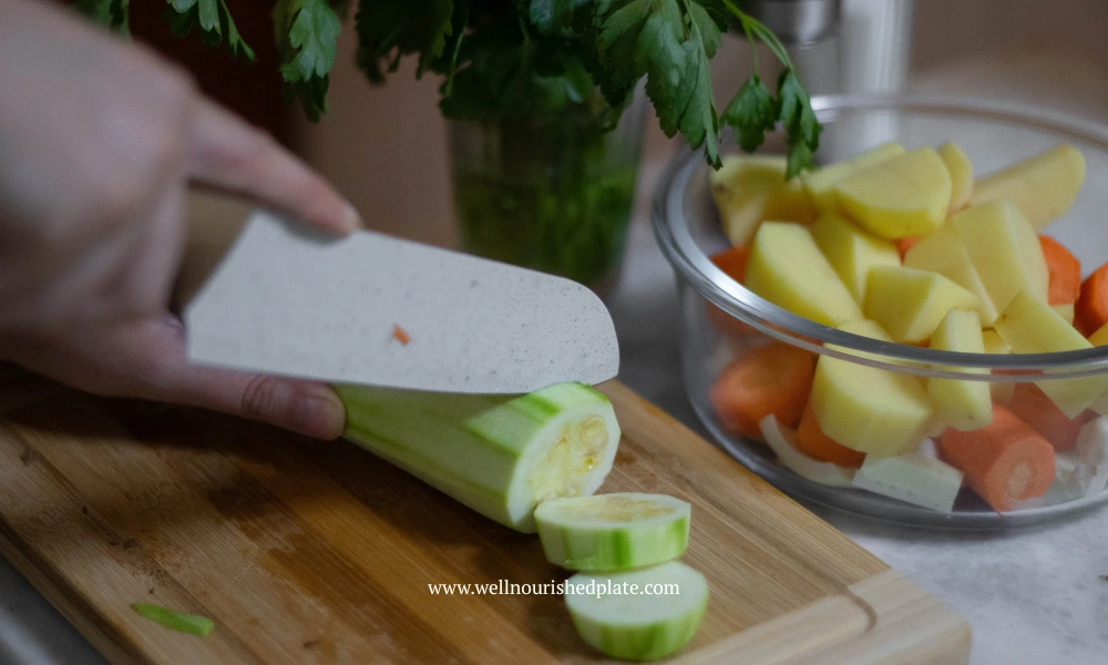 cutting zucchini on a wooden board