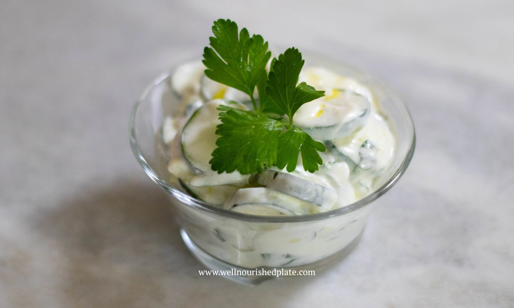 refreshing cucumber salad in a bowl with parsley
