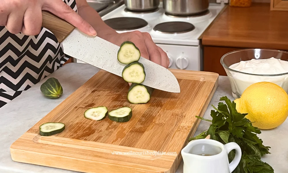 slicing cucumber with lemon for a yummy cucumber salad