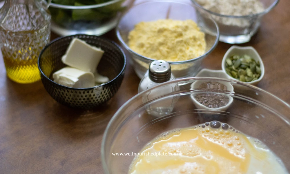 whisking eggs and milk to make spinach muffins