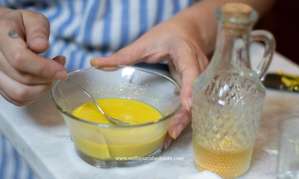 adding vinegar to dijon dressing