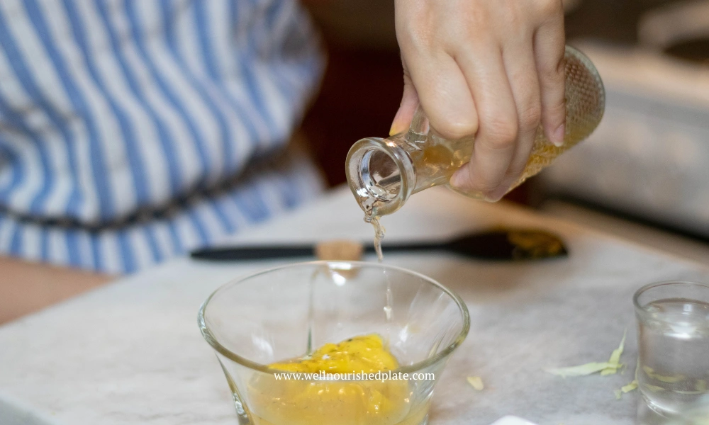 whisking the Dijon honey dressing