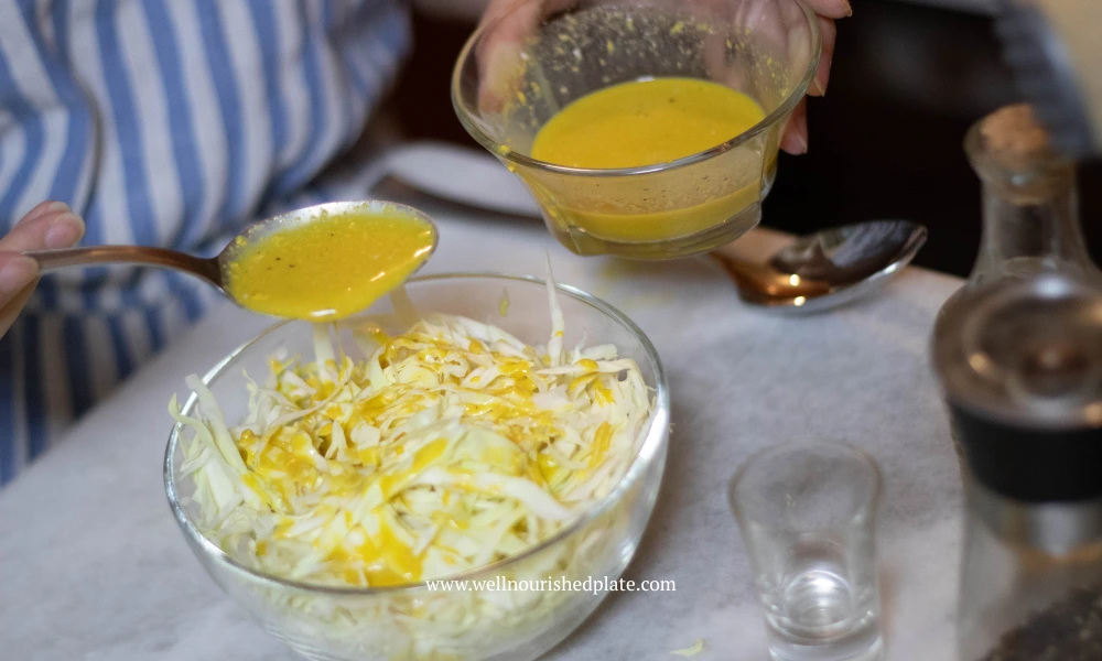 adding dijon dressing to the coleslaw