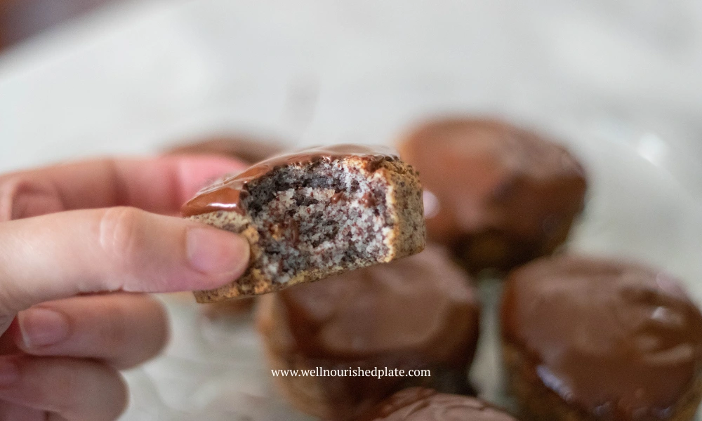 a bite of gluten free muffins with poppy seeds