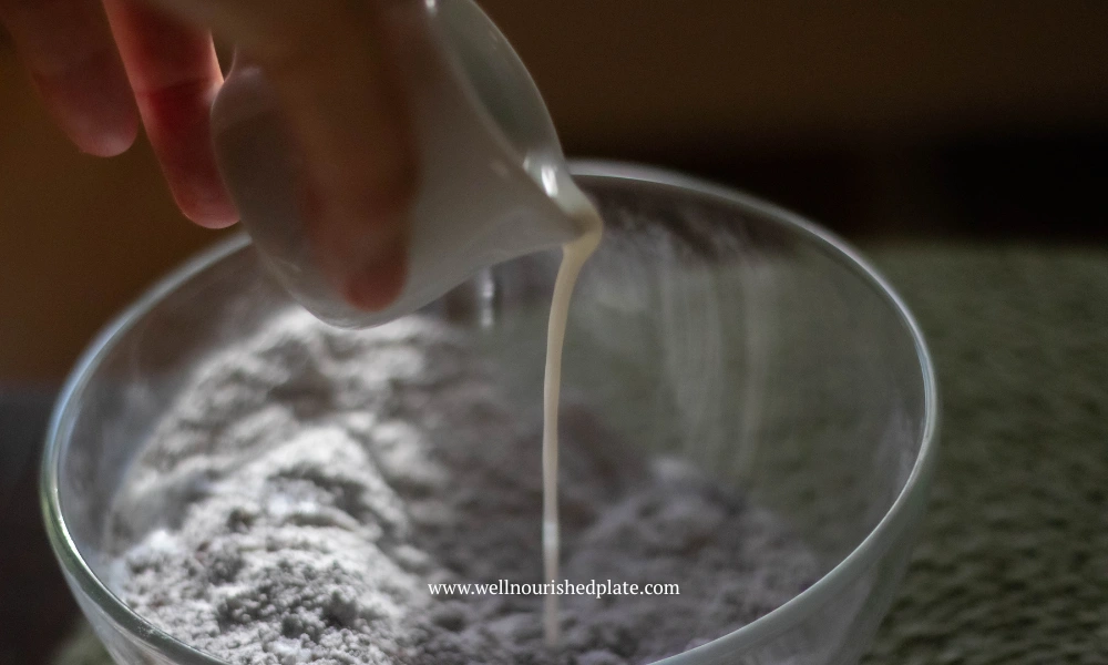 adding plant based milk to poppy seed muffins