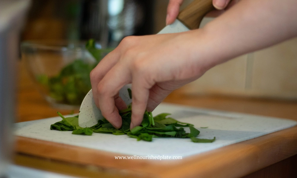 women chopping spinach