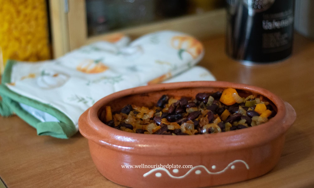baked beans in a clay dish