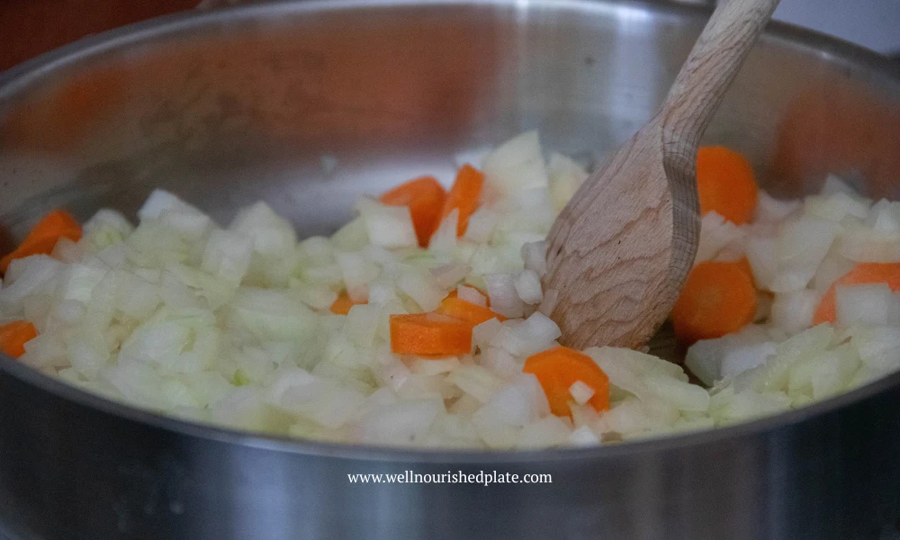 pan frying onion and carrots