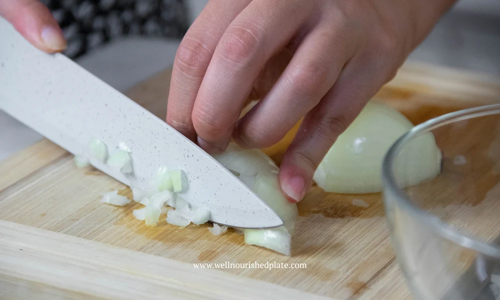 dicing the onions on a wooden board
