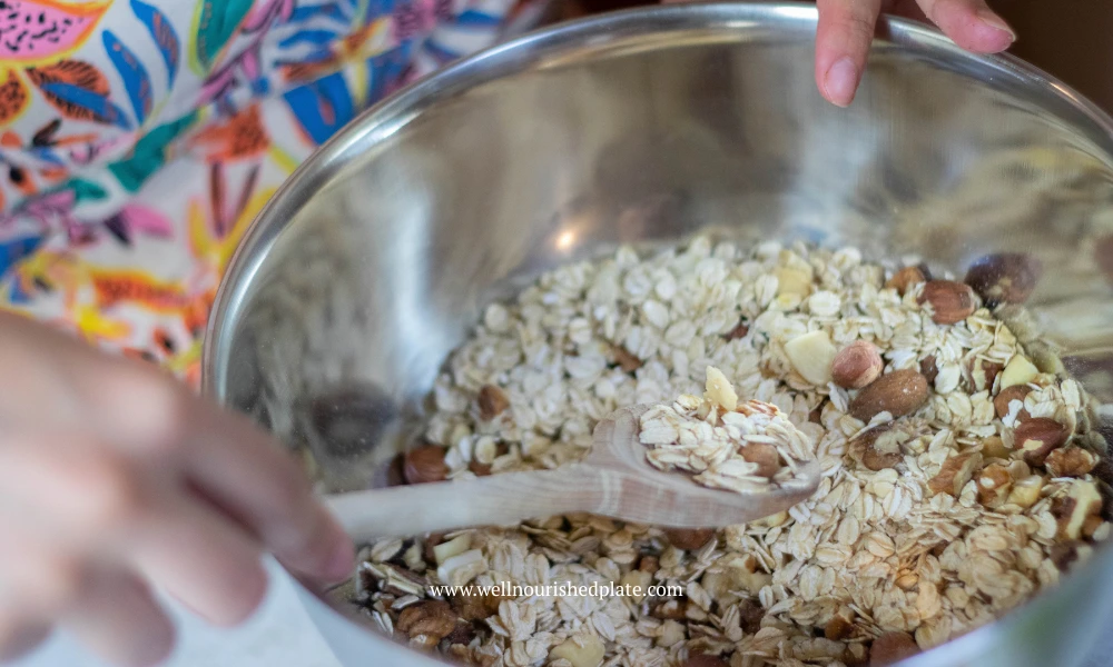 mixing the dry ingredients to make a fall granola