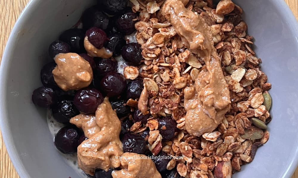 GF granola in a bowl with blueberries
