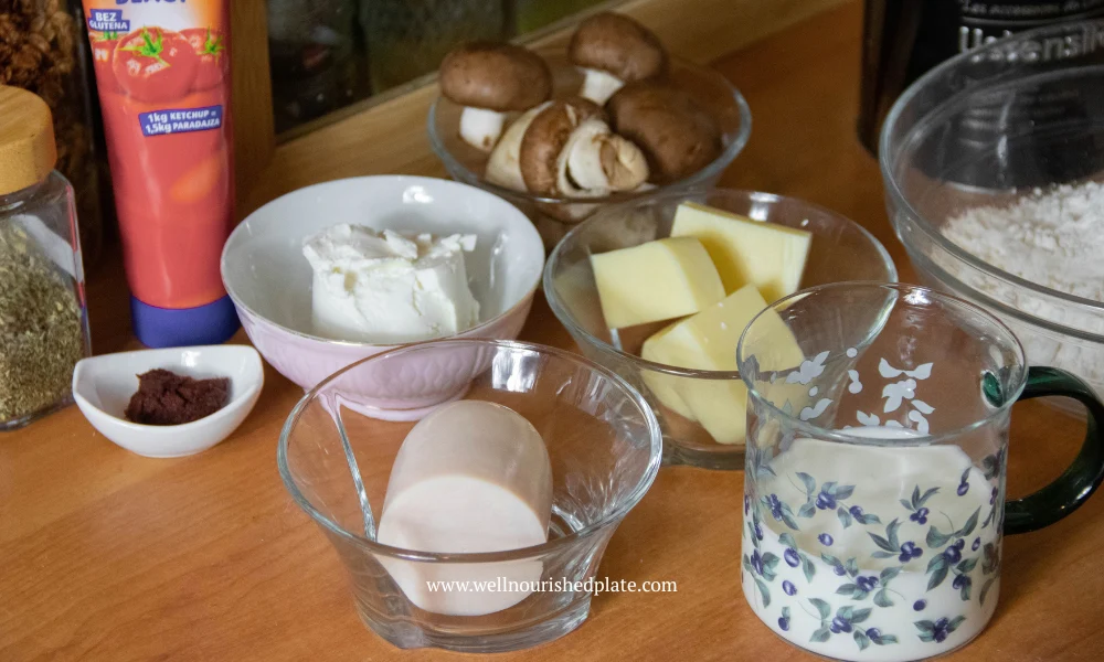 ham, gouda, ketchup - ingredients for mini pizzas on a work surface